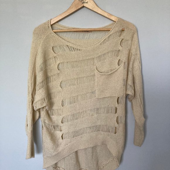 Elegant Beige Sweater with Cut-Out Design - Picture 1 of 7